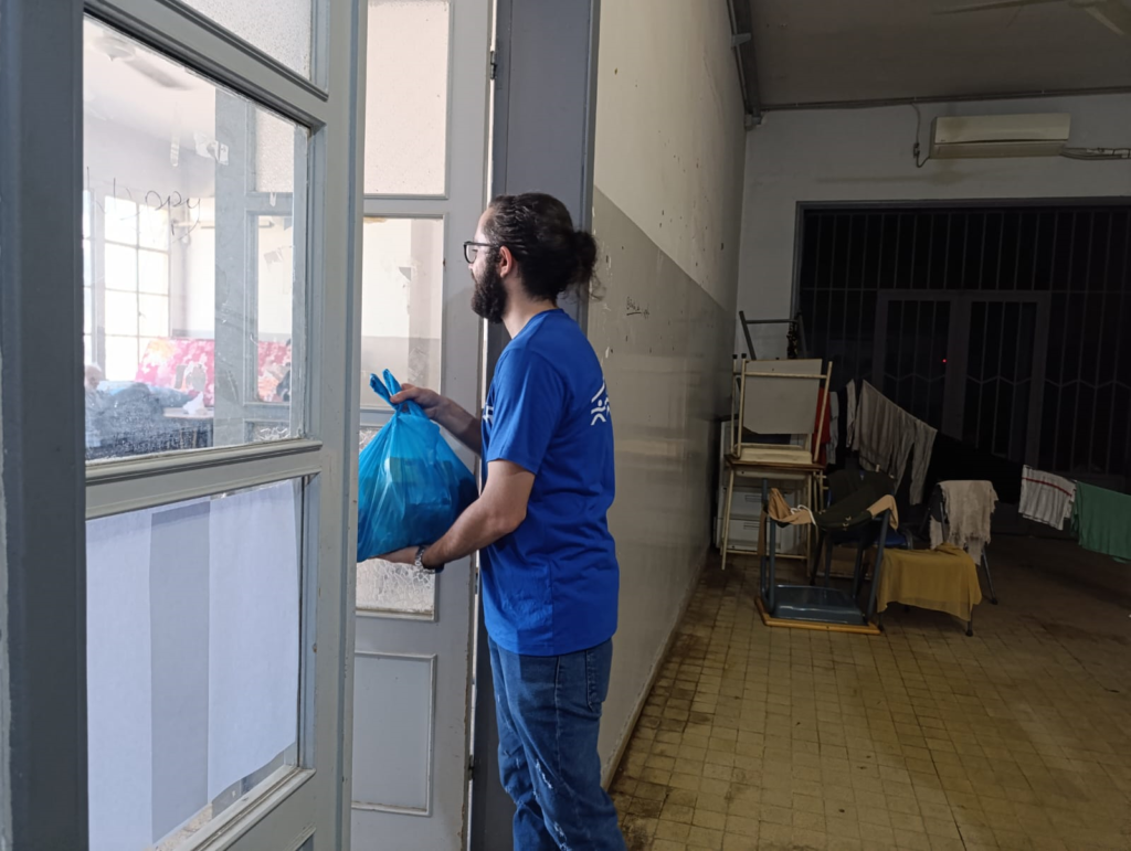 JRS Lebanon distributes bags of food and personal care products.